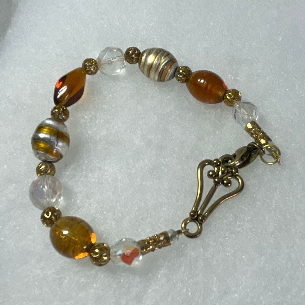 Lia Sophia discontinued bracelet faux as over faceted Ab beads bracelet.